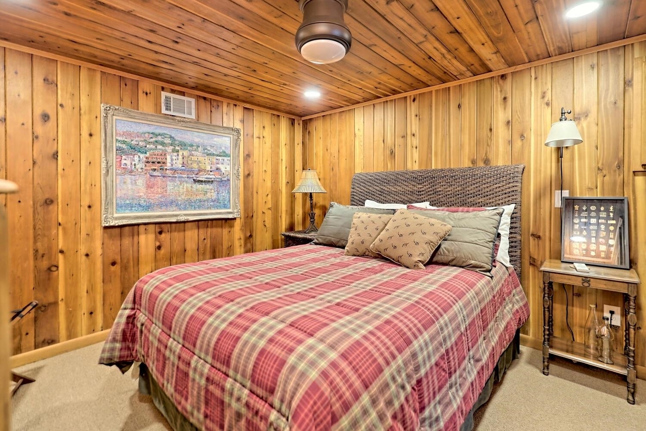 728 Oscar Rock Road Clayton, GA 30525 - Photo 23 of 40 a bedroom with a bed next to a window