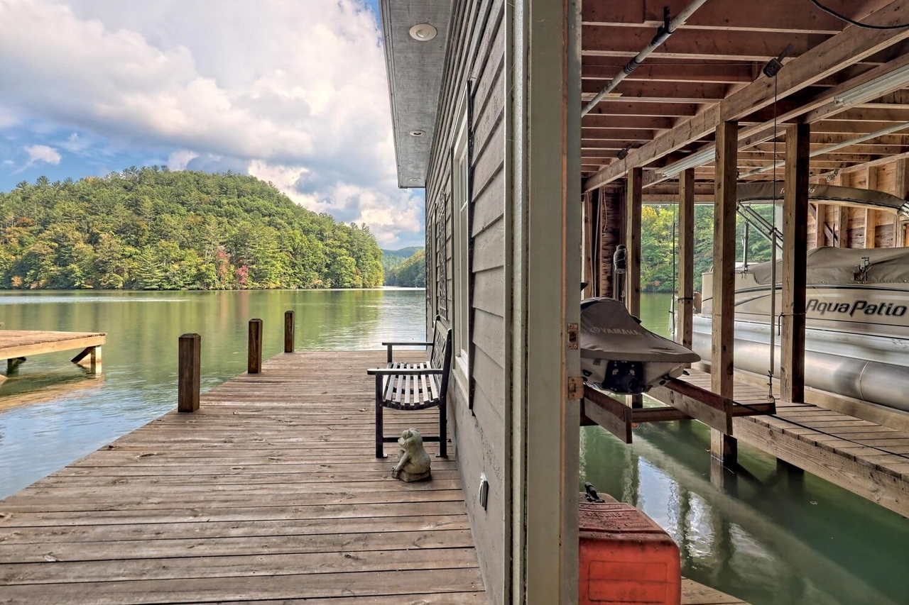 728 Oscar Rock Road Clayton, GA 30525 - Photo 34 of 40 a view of a balcony with chair and wooden floor