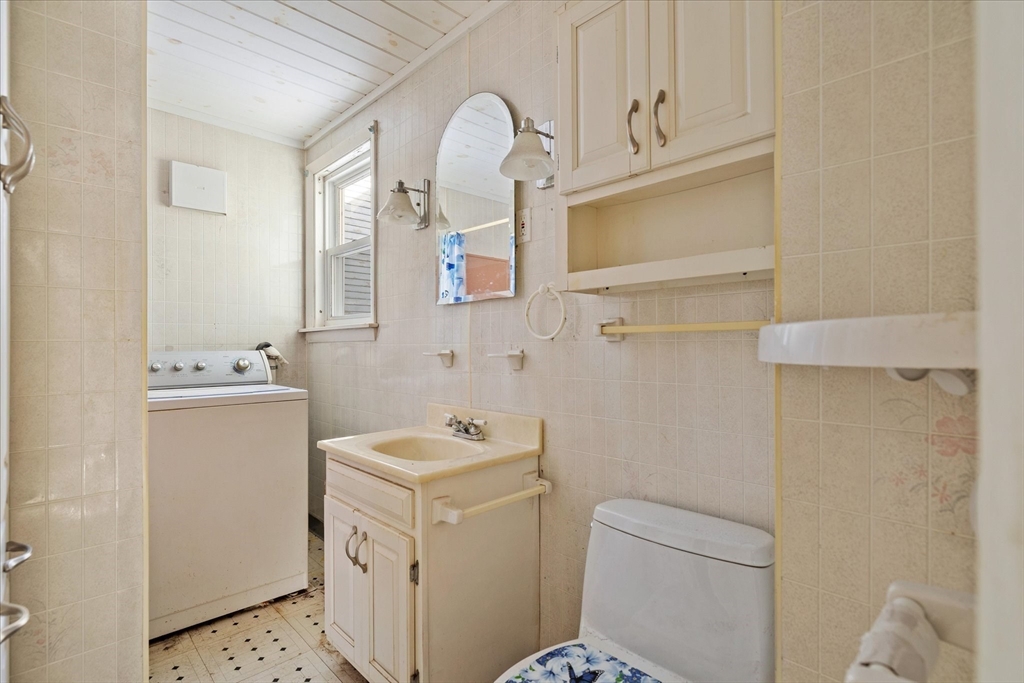 207 Hamilton Street Southbridge, MA 01550 - Photo 14 of 39 a bathroom with a sink a toilet and a mirror