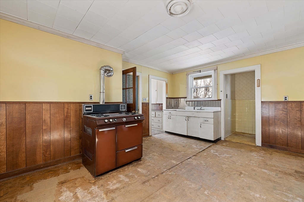 207 Hamilton Street Southbridge, MA 01550 - Photo 15 of 39 a kitchen with stainless steel appliances granite countertop a stove a sink and a refrigerator
