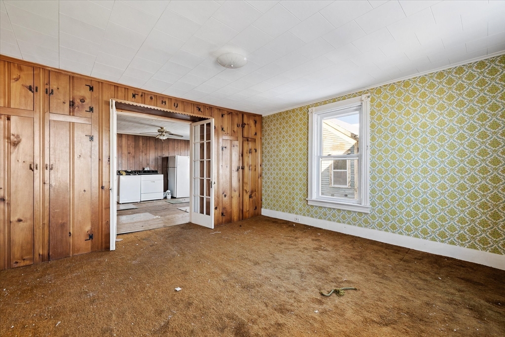 207 Hamilton Street Southbridge, MA 01550 - Photo 20 of 39 a view of empty room with a fireplace and cabinet
