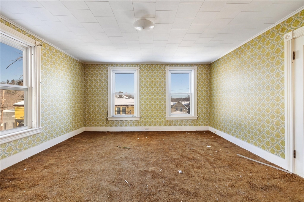 207 Hamilton Street Southbridge, MA 01550 - Photo 21 of 39 an empty room with windows