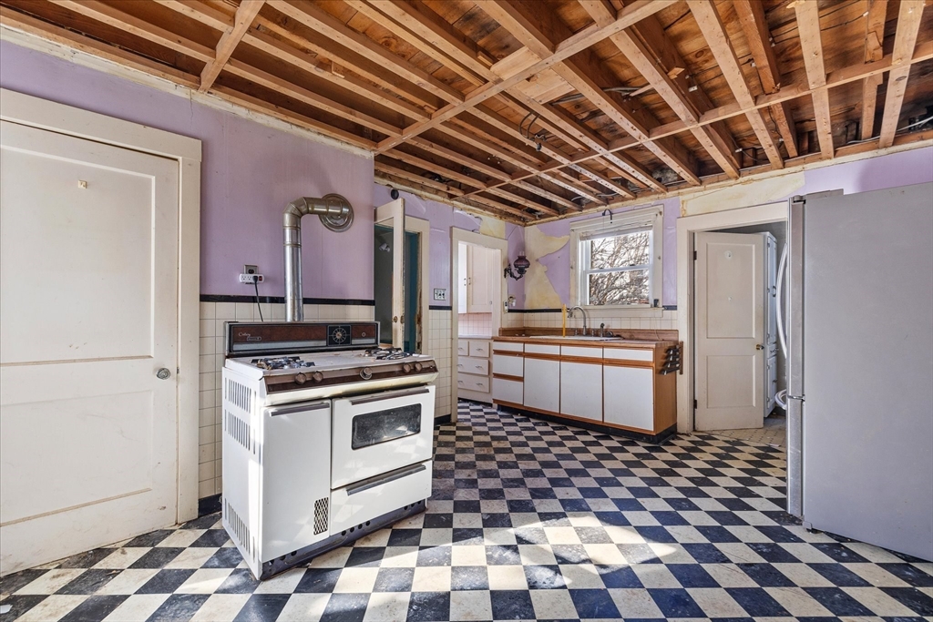 207 Hamilton Street Southbridge, MA 01550 - Photo 3 of 39 a kitchen with a stove and a refrigerator