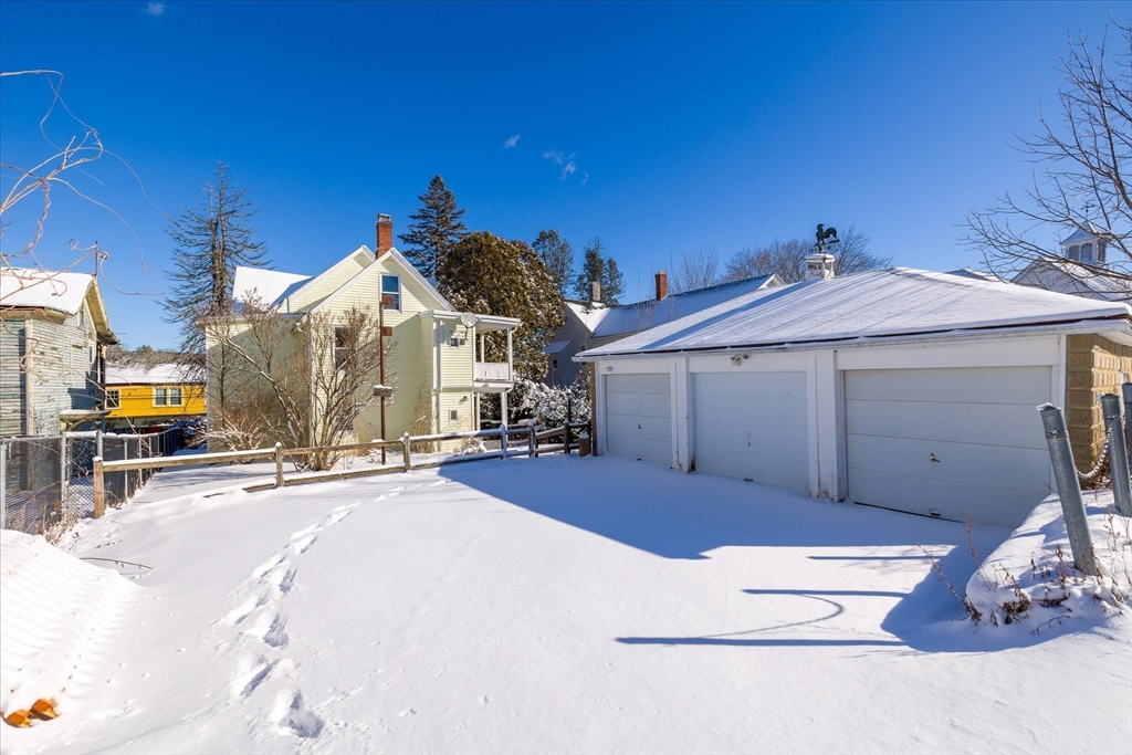 207 Hamilton Street Southbridge, MA 01550 - Photo 36 of 39 a view of a house with snow on the road and covered with tall trees