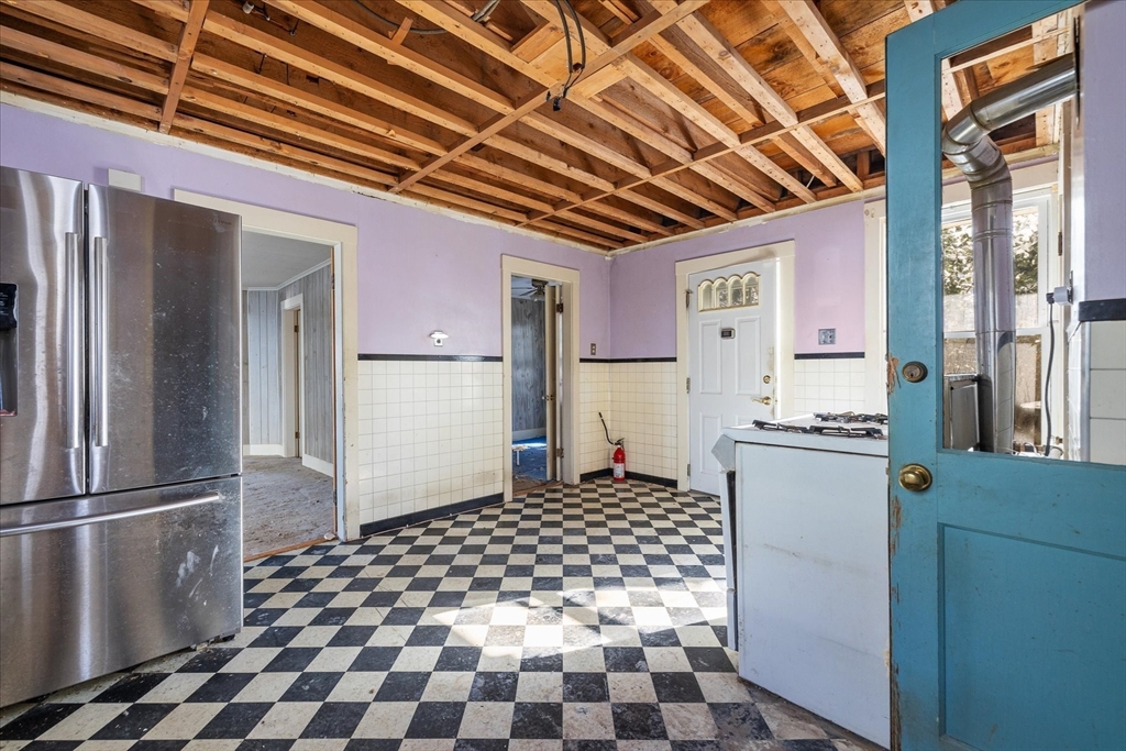 207 Hamilton Street Southbridge, MA 01550 - Photo 5 of 39 a kitchen with a refrigerator a sink and dishwasher