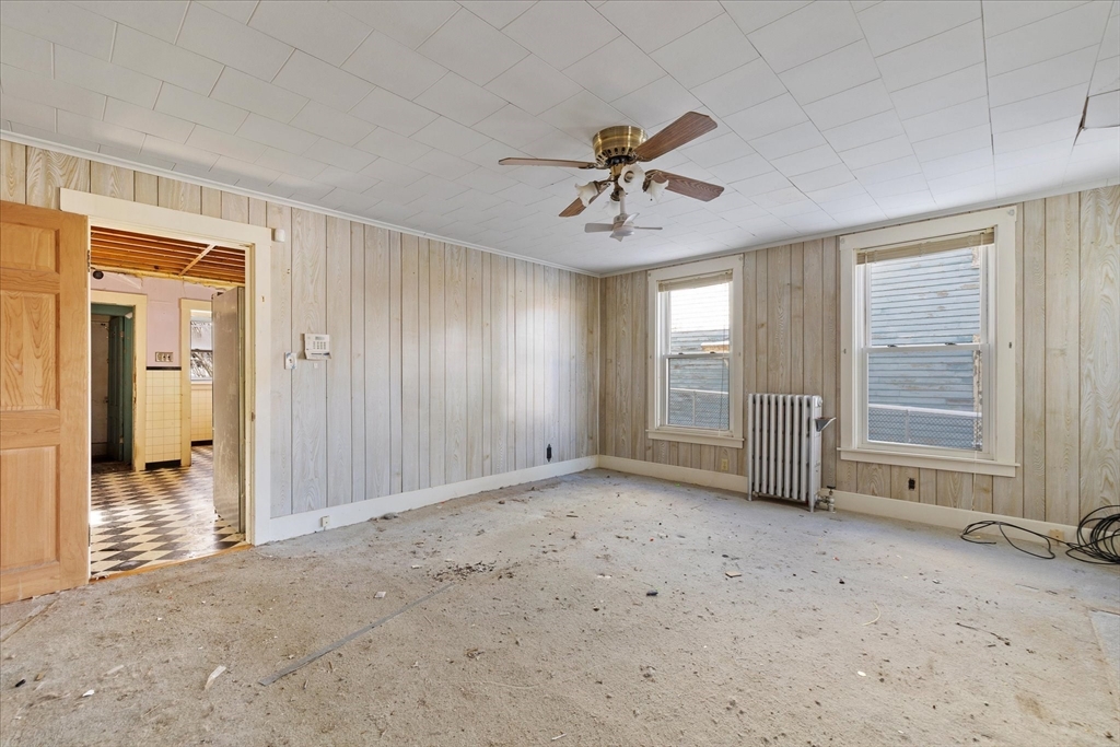 207 Hamilton Street Southbridge, MA 01550 - Photo 7 of 39 a view of a livingroom with a chandelier fan and closet area