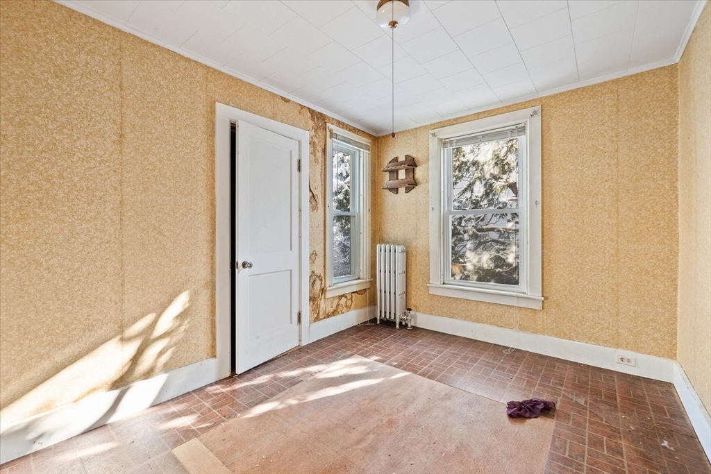 207 Hamilton Street Southbridge, MA 01550 - Photo 10 of 39 a view of an empty room with a window