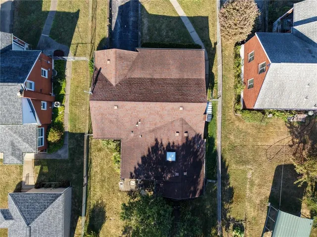 an aerial view of houses with outdoor space