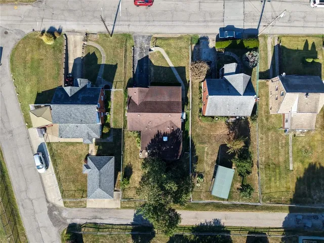 an aerial view of houses with outdoor space