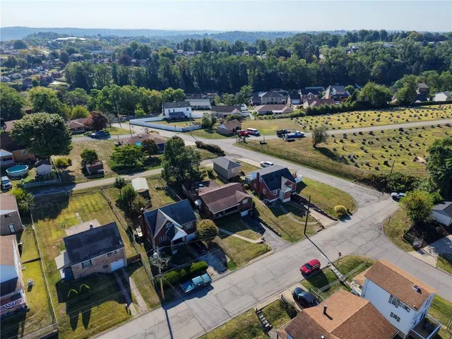 an aerial view of a house with a garden