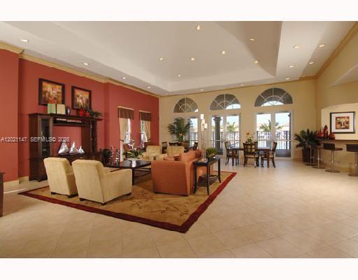 5930 Abbey Road Tamarac, FL 33321 - Photo 23 of 26 a living room with furniture and a large window