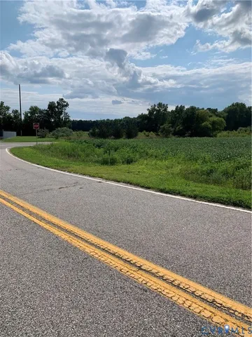 a view of a field with grass and stairs