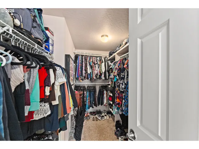 a view of a closet with storage
