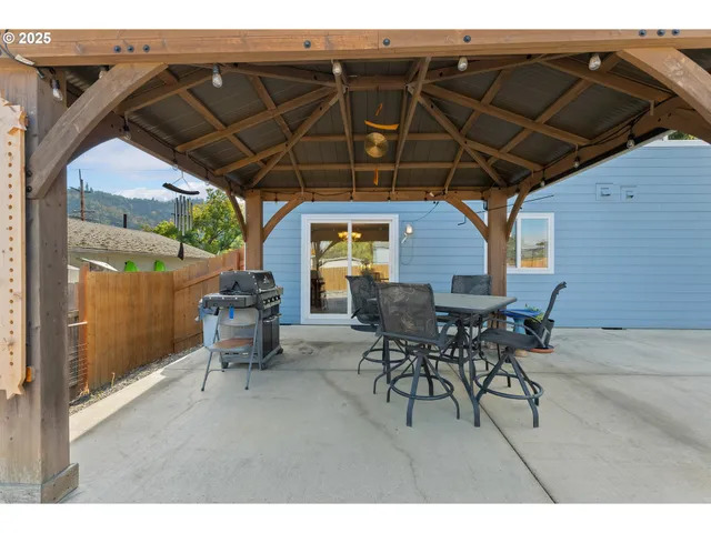 a patio with table and chairs