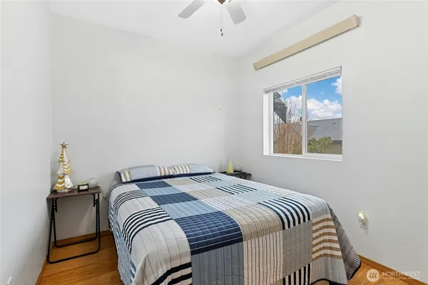 a bedroom with a bed and a window