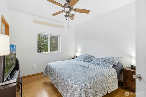 a bedroom with a bed and a window