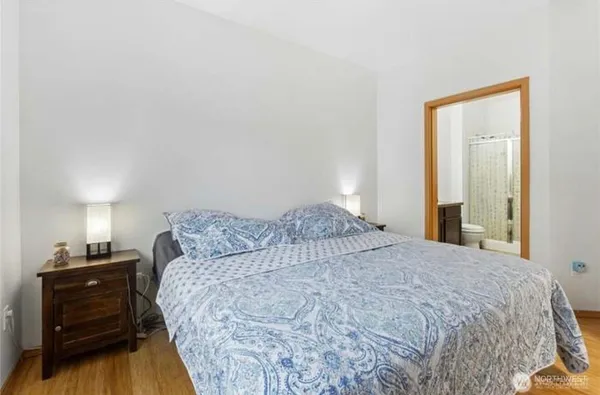 a bedroom with a bed and a closet