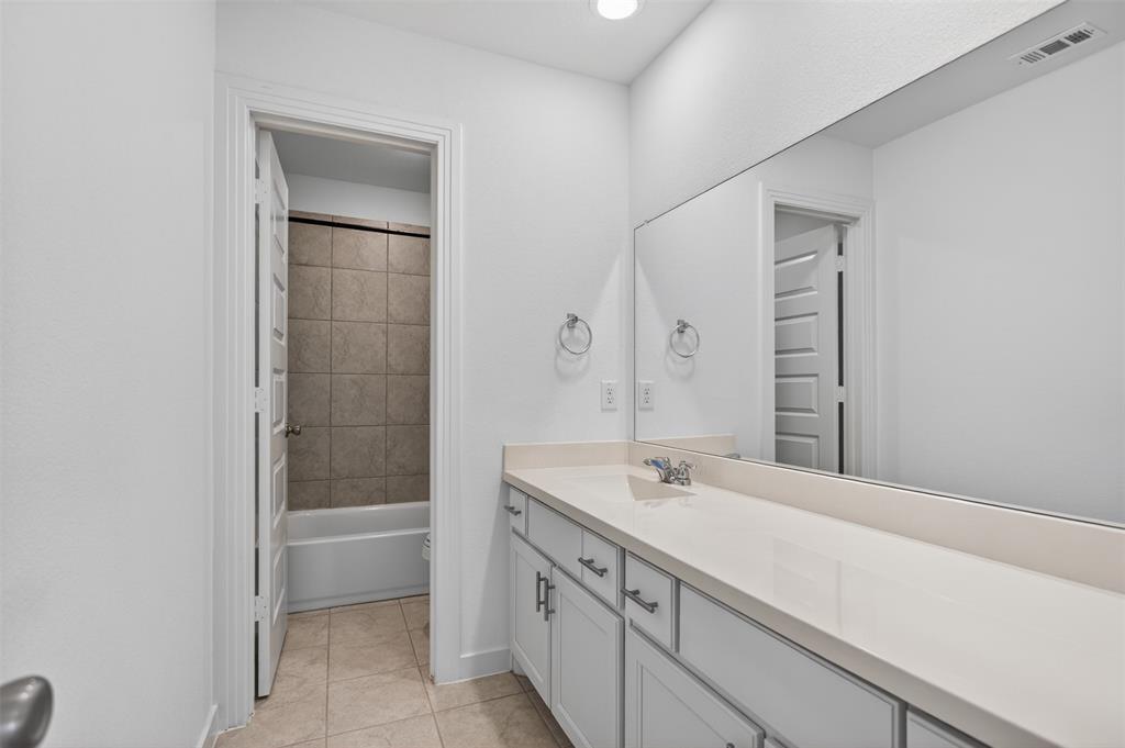 629 Claverton Lane Forney, TX 75126 - Photo 19 of 33 a bathroom with a sink a toilet and shower