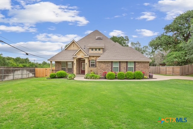 3306 Spring Canyon Road Belton, TX 76513 - Photo 2 of 40 a front view of a house with garden