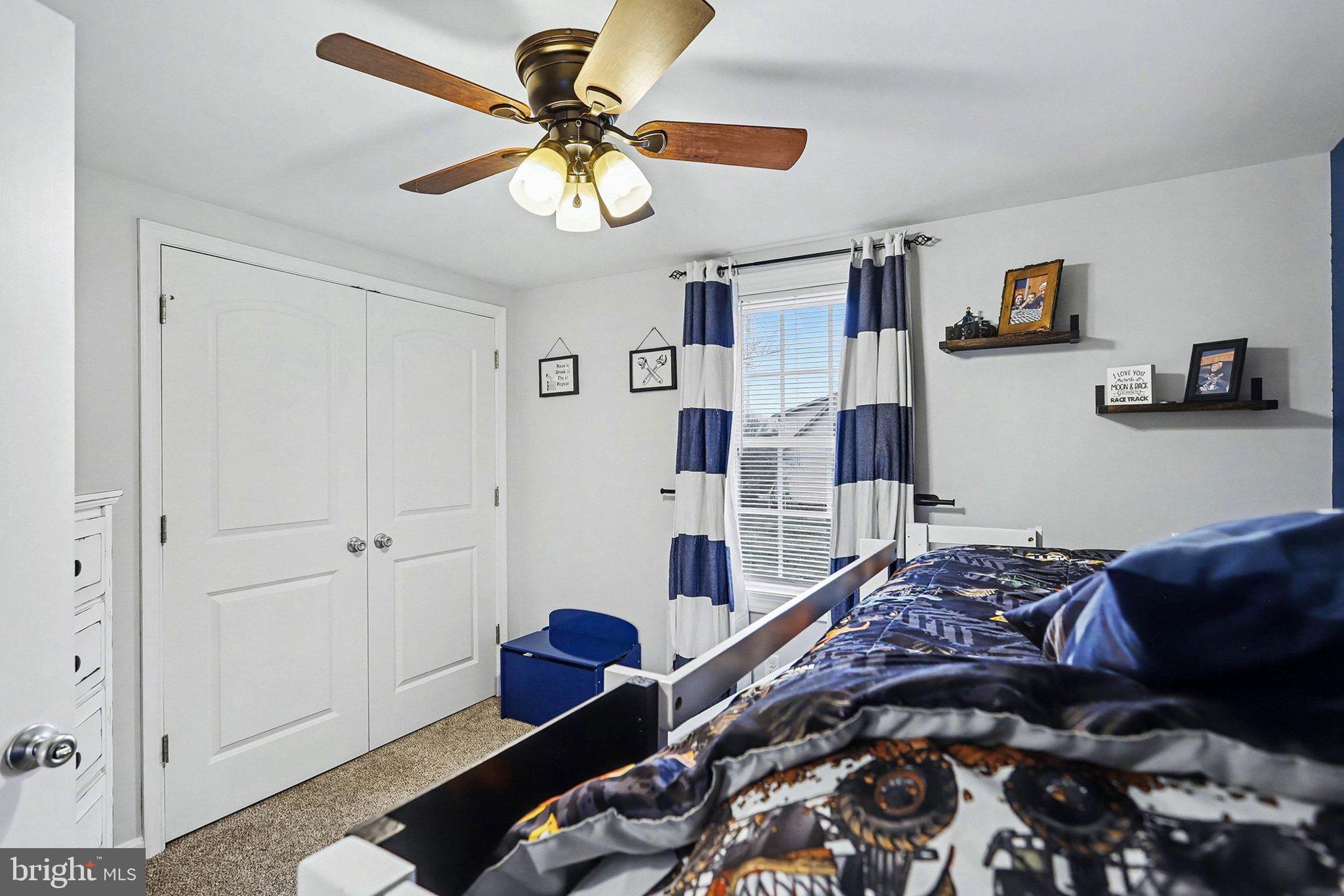 774 Fairview Drive Hanover, PA 17331 - Photo 14 of 32 a bedroom with a bed and a chandelier