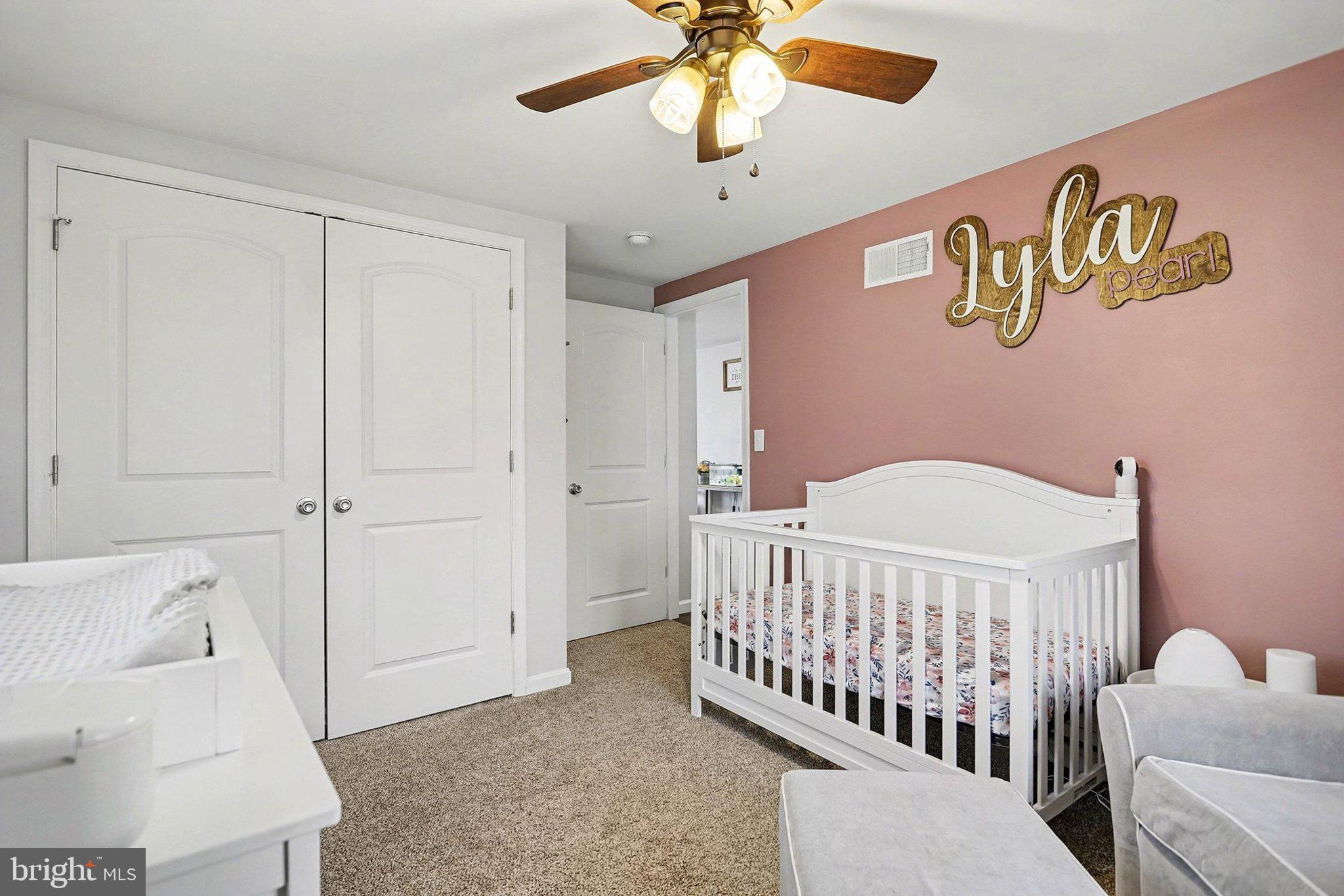 774 Fairview Drive Hanover, PA 17331 - Photo 17 of 32 a view of a bedroom with wooden floor & a ceiling fan