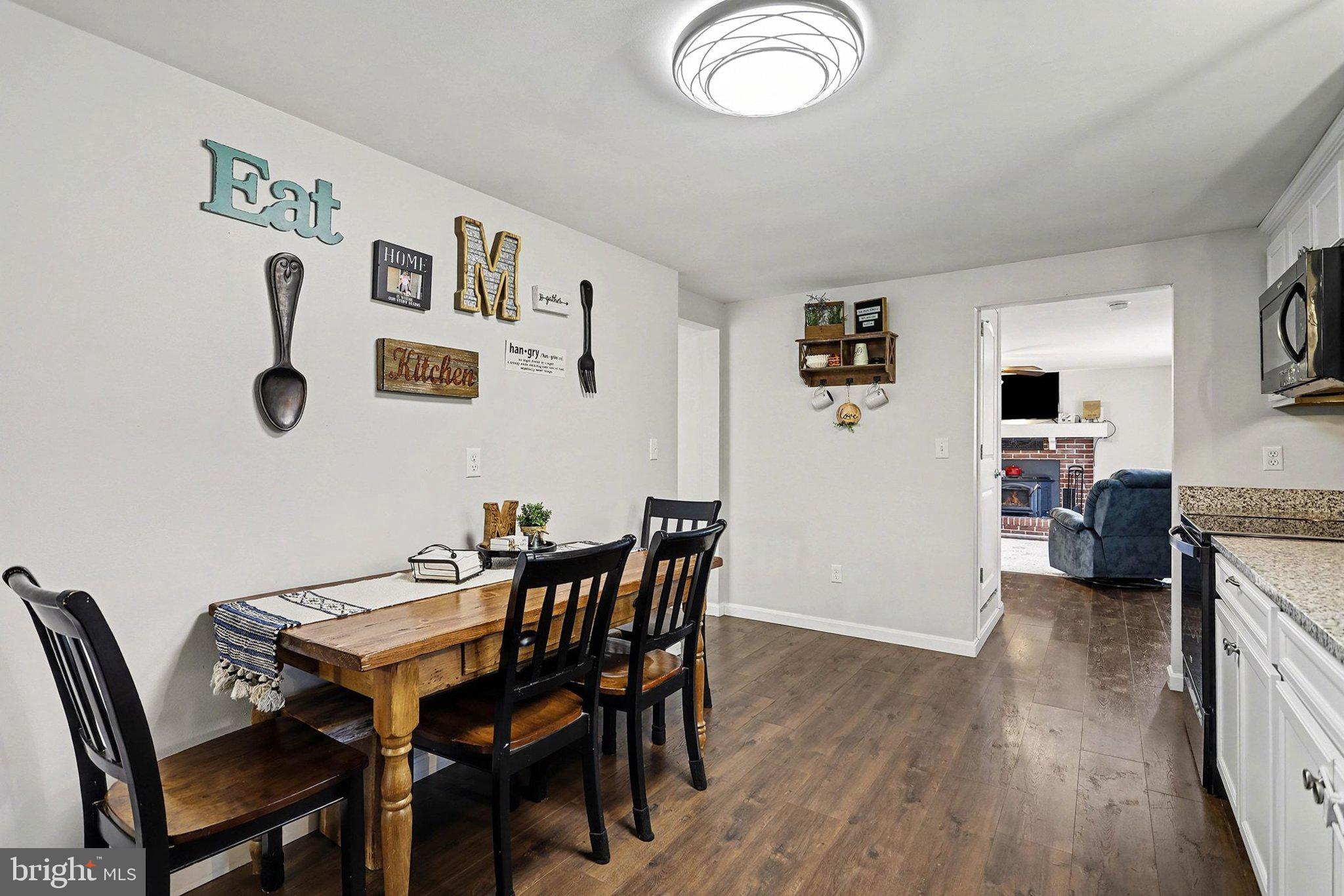 774 Fairview Drive Hanover, PA 17331 - Photo 9 of 32 a view of a dining room with furniture and wooden floor