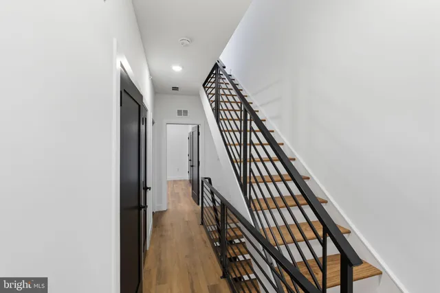 a view of stairs with wooden floor