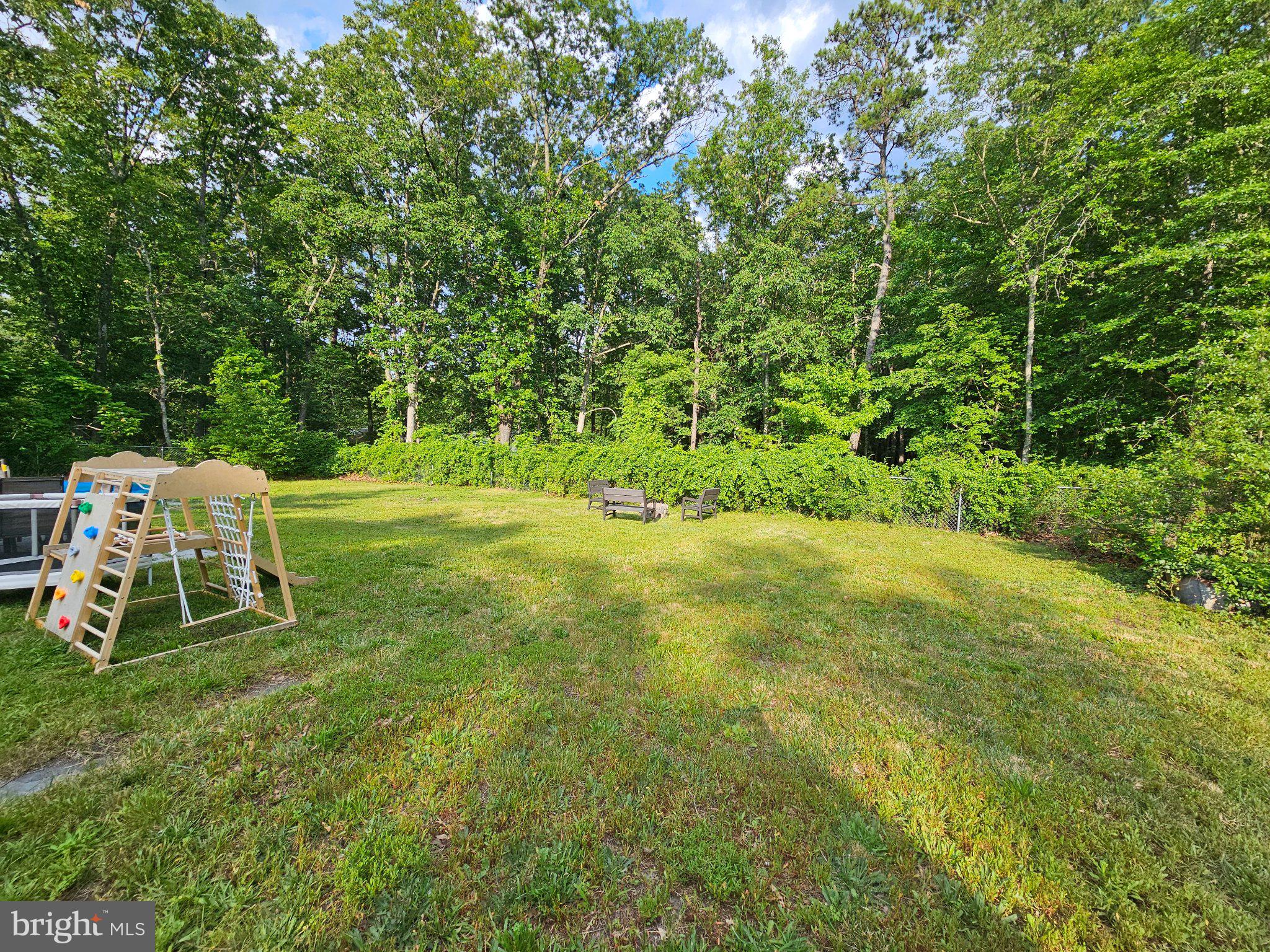 501 Junction Road Browns Mills, NJ 08015 - Photo 18 of 25 Serene backyard oasis surrounded by trees.