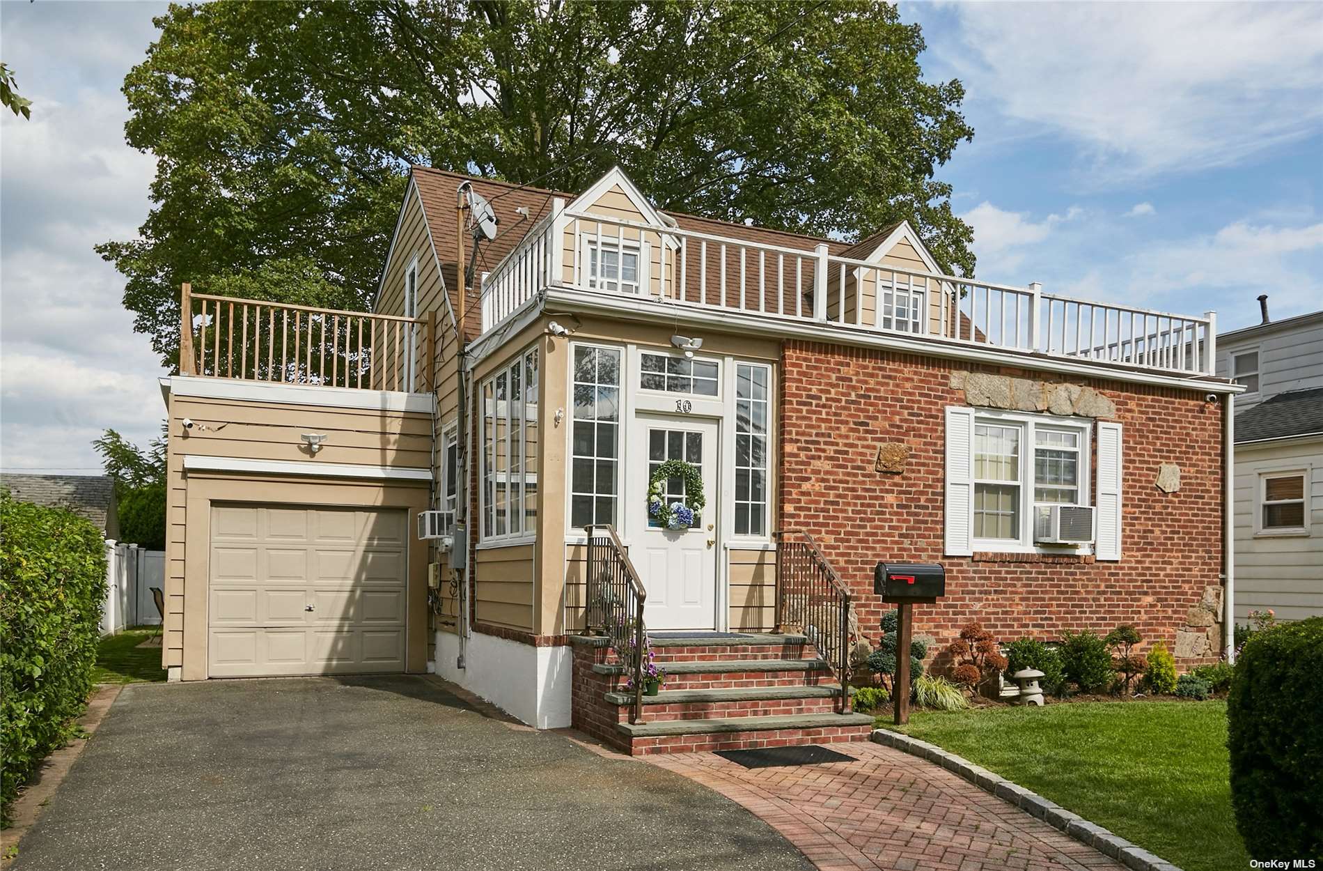 10 Christabel Street Lynbrook, NY 11563 - Photo 1 of 29 front view of a house with a yard