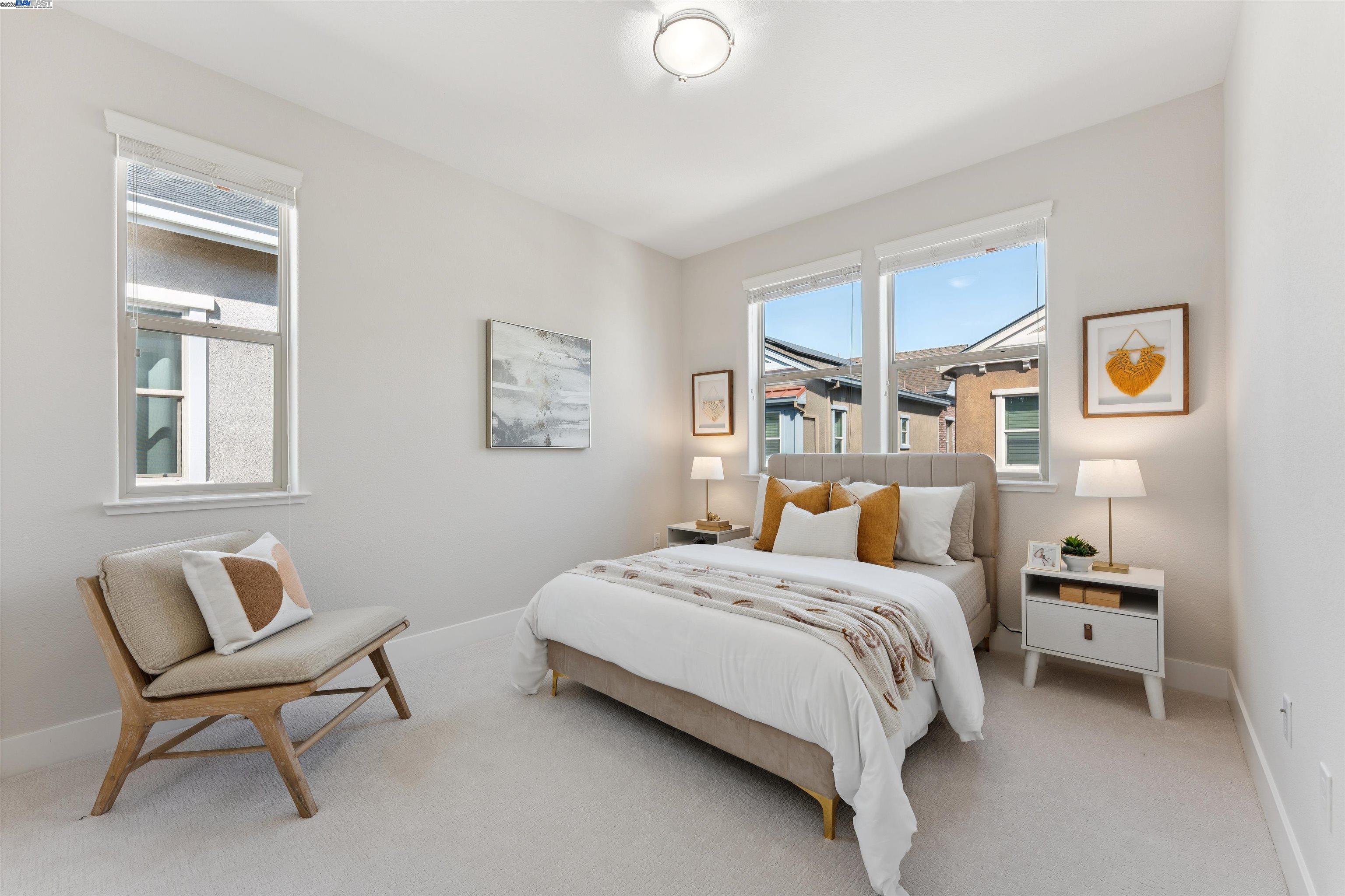 1360 Brookline Loop Pleasanton, CA 94566 - Photo 19 of 29 a bedroom with a bed chair and painting on the wall