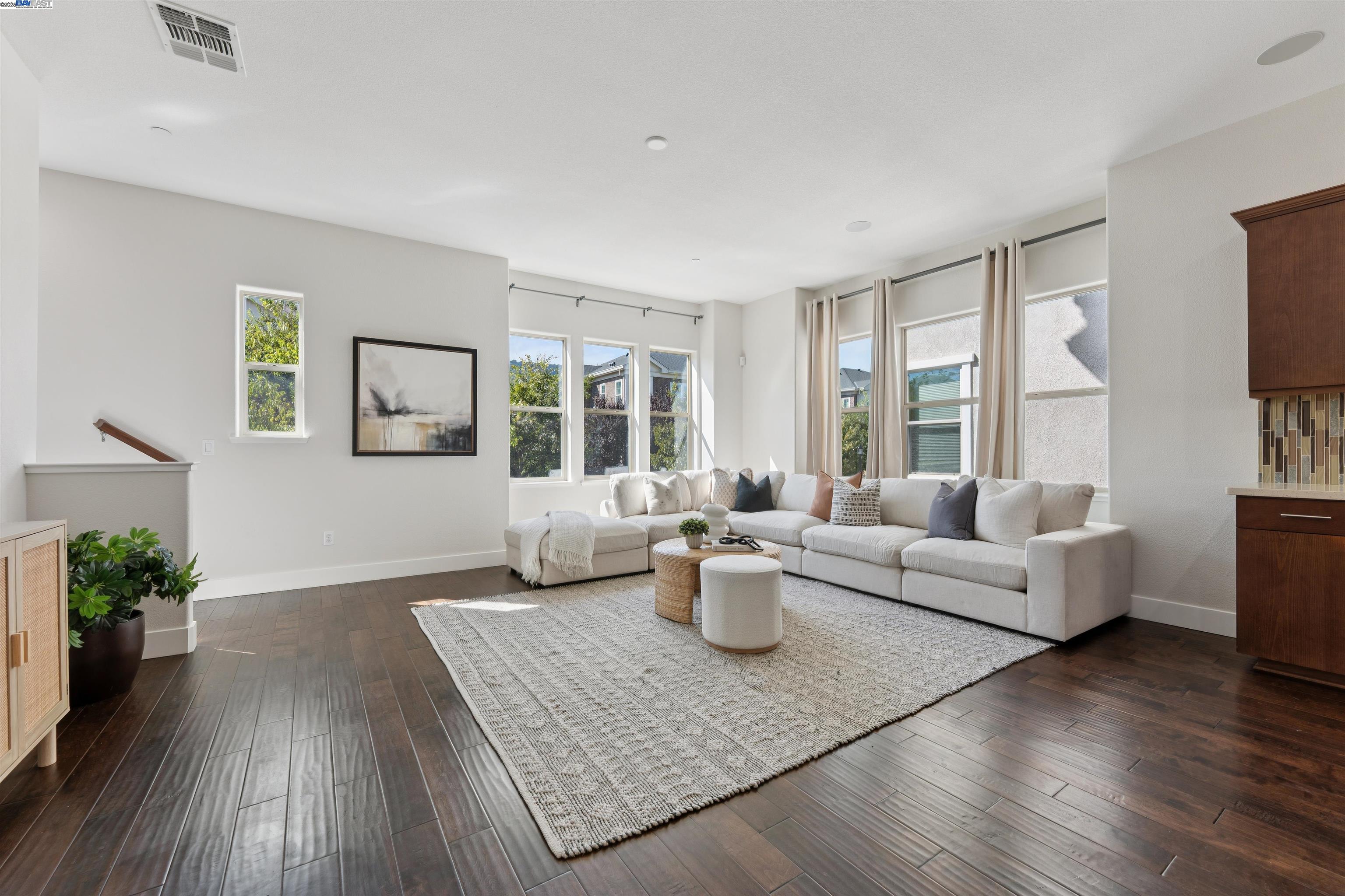 1360 Brookline Loop Pleasanton, CA 94566 - Photo 6 of 29 a living room with fireplace furniture and a wooden floor