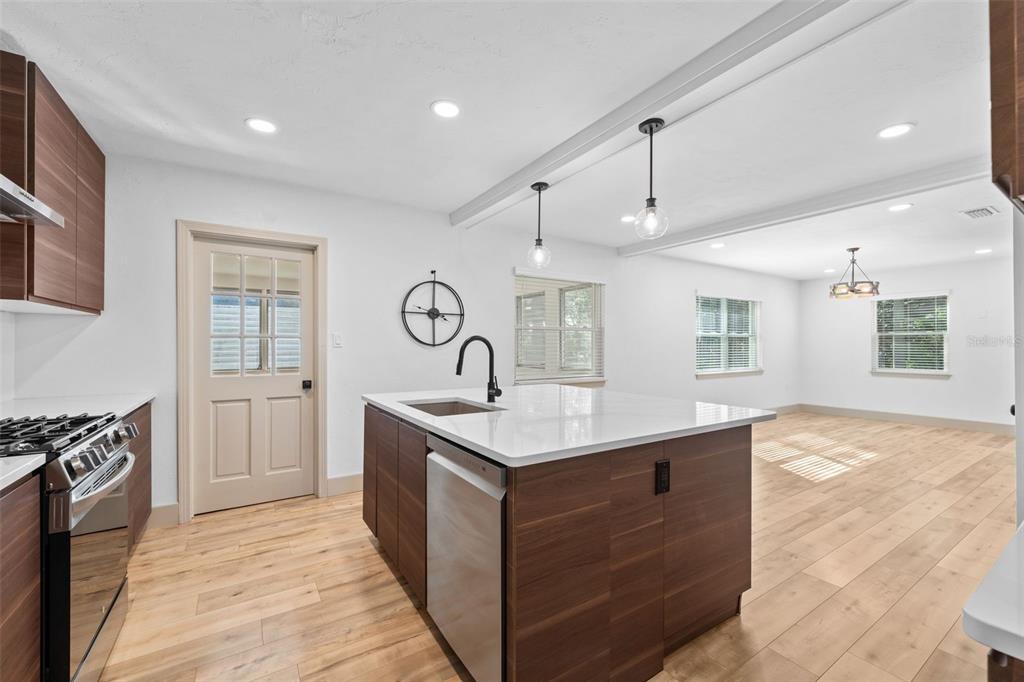 815 Northeast 12th Avenue Gainesville, FL 32601 - Photo 12 of 31 a kitchen with a stove and a sink