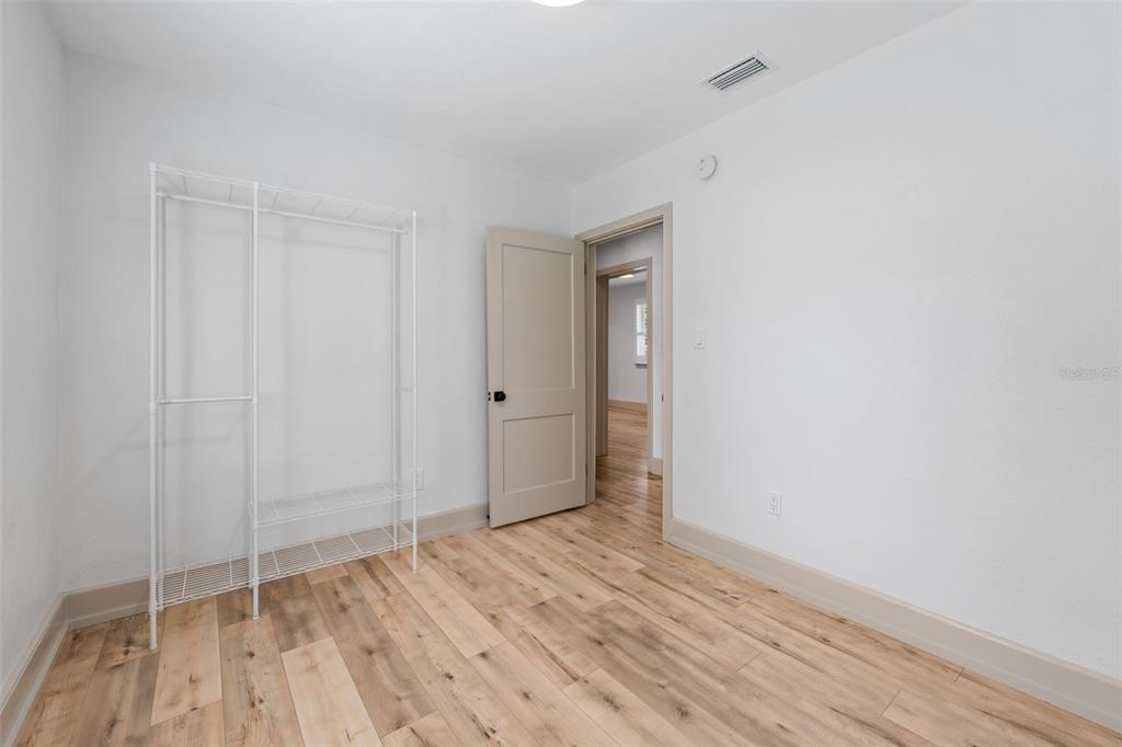 815 Northeast 12th Avenue Gainesville, FL 32601 - Photo 19 of 31 a view of an empty room with wooden floor