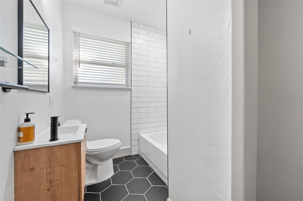 815 Northeast 12th Avenue Gainesville, FL 32601 - Photo 22 of 31 a bathroom with a toilet and a sink
