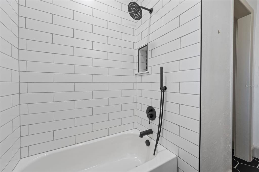 815 Northeast 12th Avenue Gainesville, FL 32601 - Photo 23 of 31 a bathroom with a bathtub