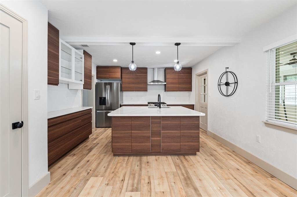815 Northeast 12th Avenue Gainesville, FL 32601 - Photo 9 of 31 a view of living room with granite countertop furniture and wooden floor