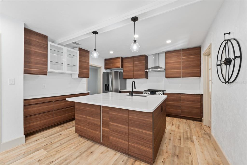 815 Northeast 12th Avenue Gainesville, FL 32601 - Photo 10 of 31 a kitchen with a sink appliances and cabinets