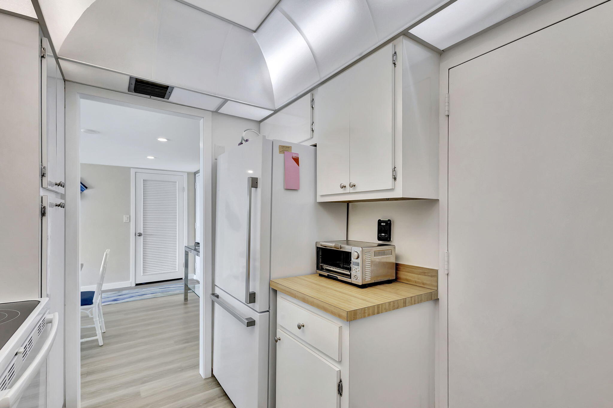 2600 North Flagler Drive, Unit 310 West Palm Beach, FL 33407 - Photo 11 of 42 a kitchen with stainless steel appliances a stove refrigerator sink and cabinets