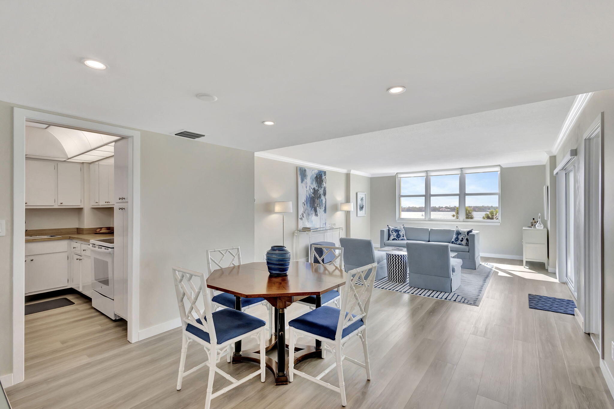 2600 North Flagler Drive, Unit 310 West Palm Beach, FL 33407 - Photo 13 of 42 a view of a dining room with furniture window and wooden floor