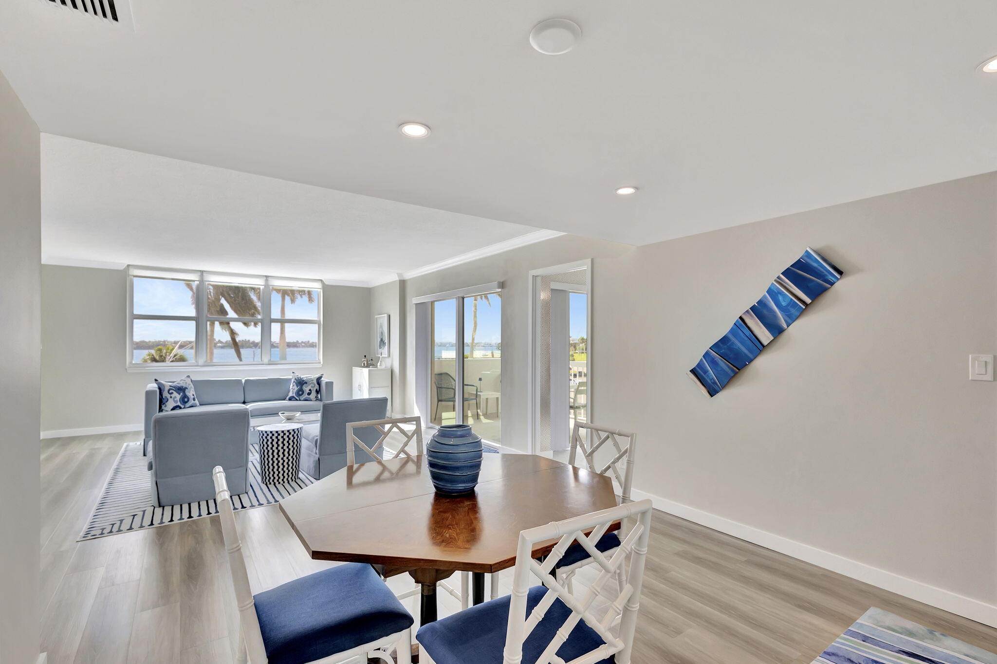 2600 North Flagler Drive, Unit 310 West Palm Beach, FL 33407 - Photo 14 of 42 a view of a dining room with furniture and wooden floor
