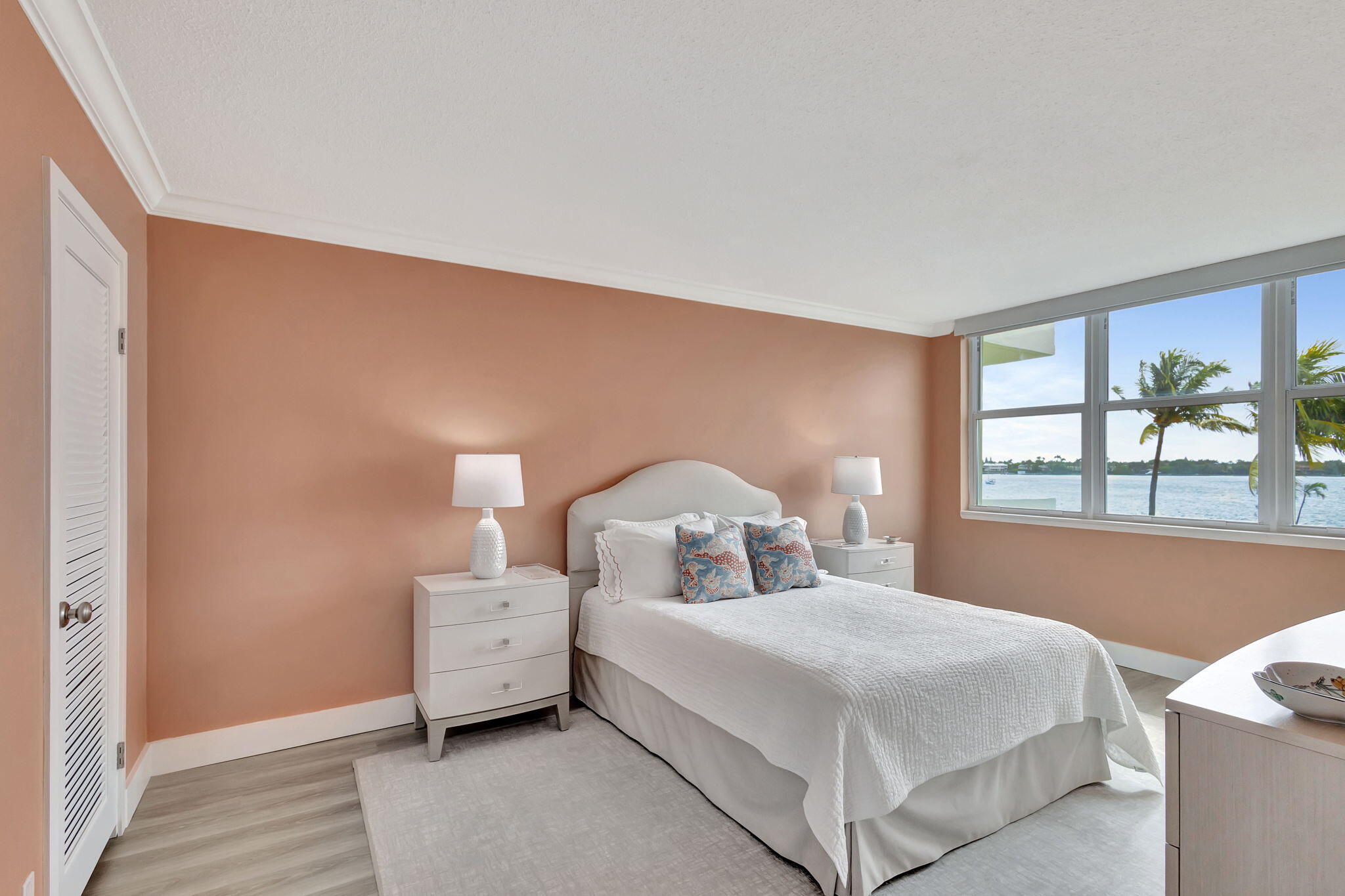 2600 North Flagler Drive, Unit 310 West Palm Beach, FL 33407 - Photo 16 of 42 a bedroom with a bed and a large window