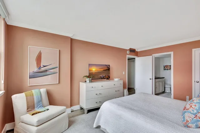 a bedroom with a bed and furniture