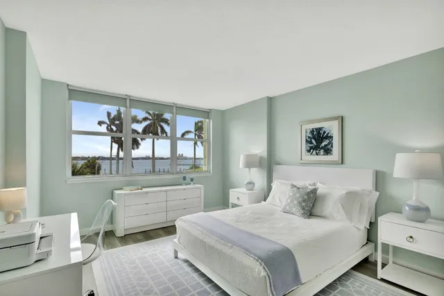 a bedroom with a bed and a desk