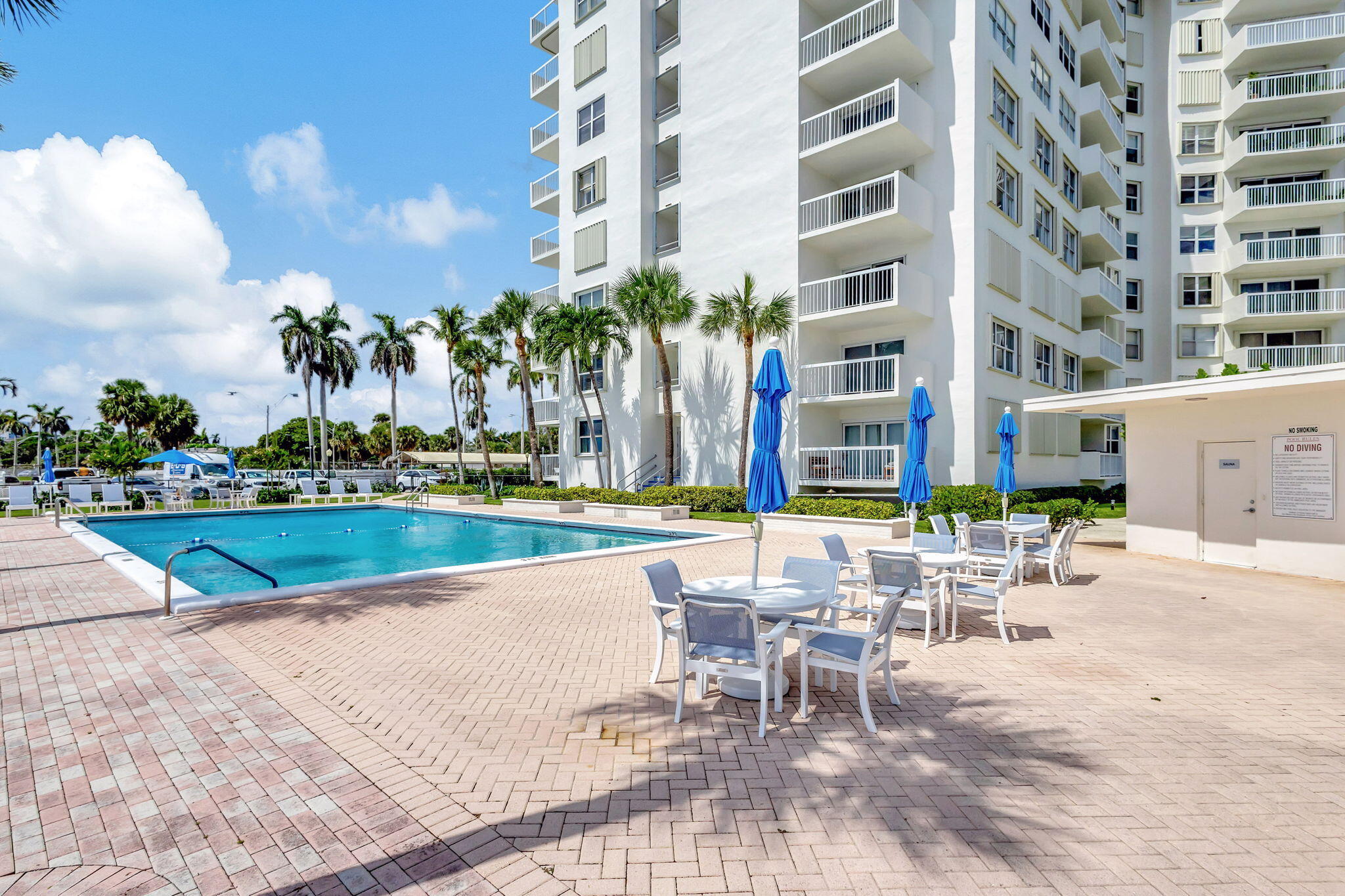 2600 North Flagler Drive, Unit 310 West Palm Beach, FL 33407 - Photo 33 of 42 a view of a swimming pool with a lounge chairs
