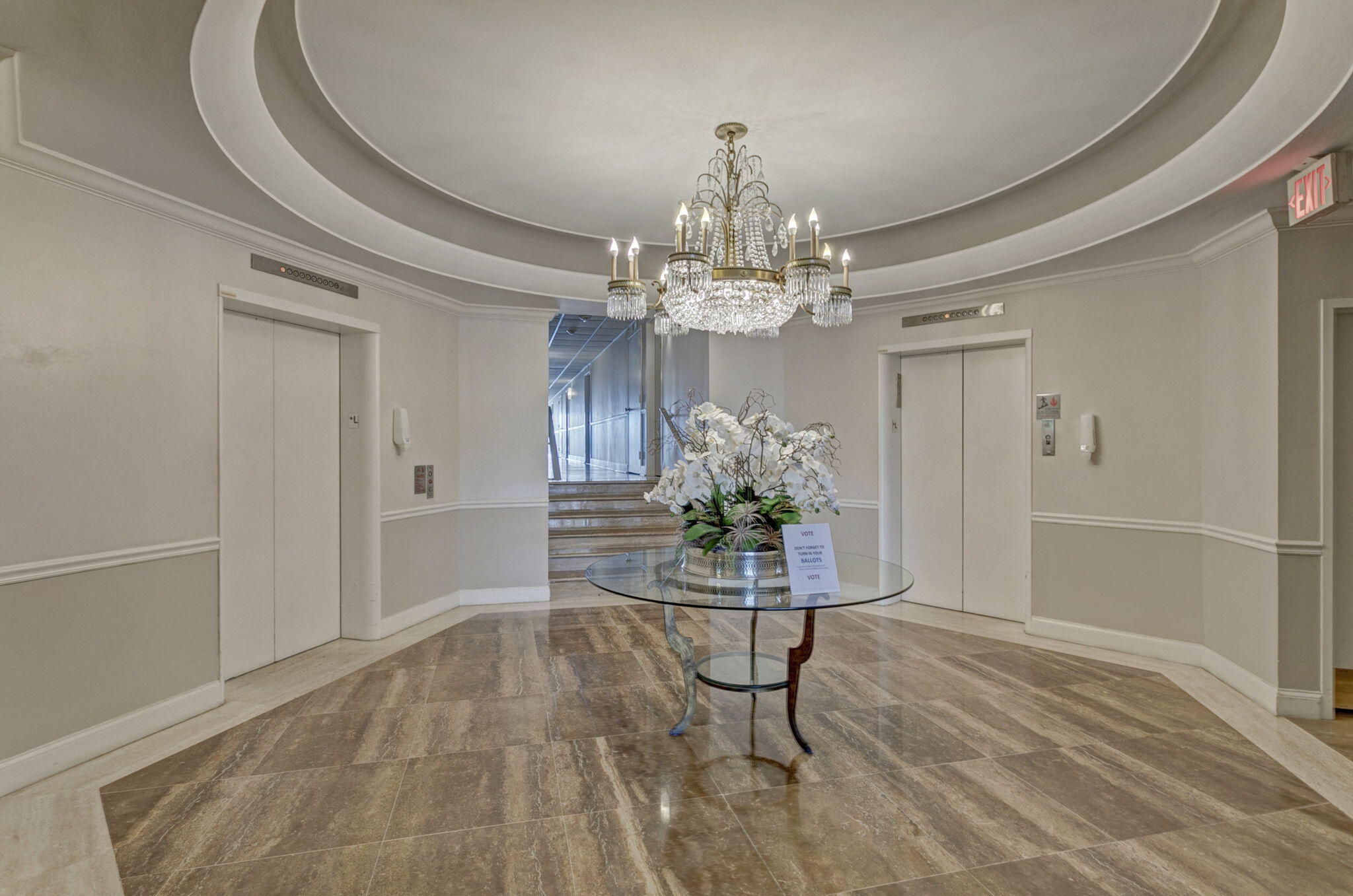 2600 North Flagler Drive, Unit 310 West Palm Beach, FL 33407 - Photo 35 of 42 a dining room with chandelier and glass door