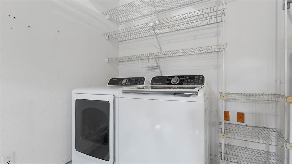 11029 Einbender Road Orlando, FL 32825 - Photo 16 of 27 a utility room with dryer and washer
