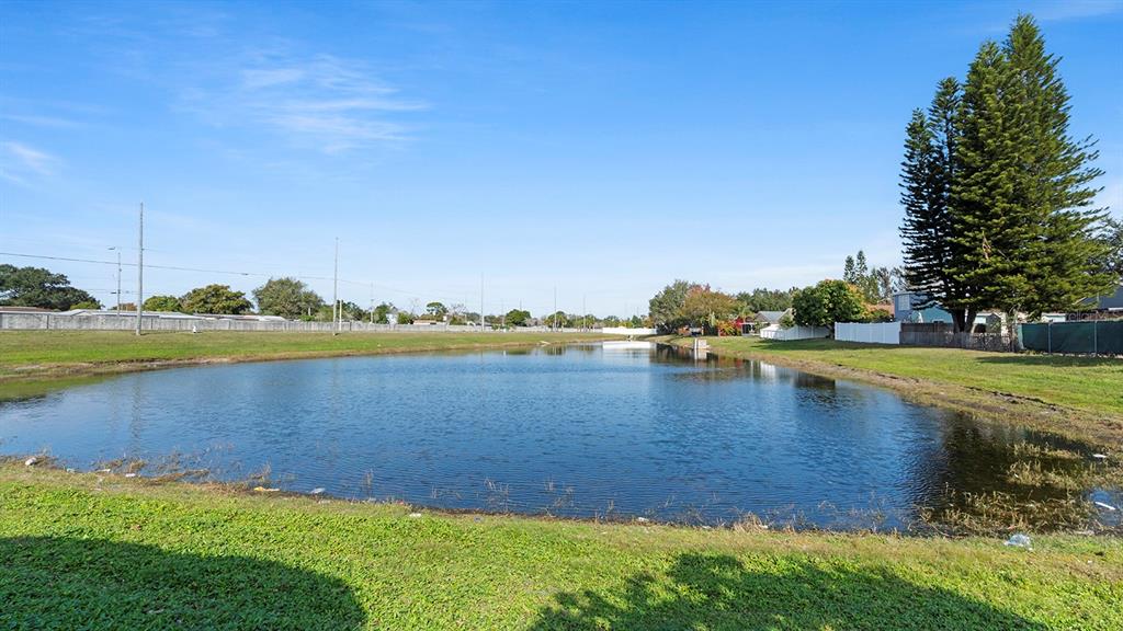 11029 Einbender Road Orlando, FL 32825 - Photo 19 of 27 a view of a lake with houses in the background