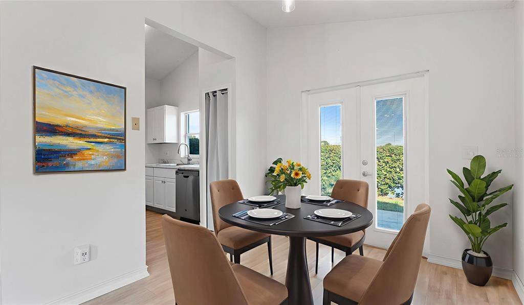 11029 Einbender Road Orlando, FL 32825 - Photo 4 of 27 a view of a dining room with furniture and wooden floor