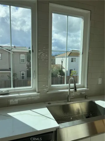 a kitchen with a sink and a window
