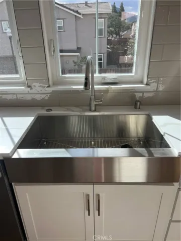 a close view of sink and washing machine